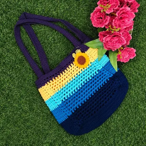 Striped crochet tote bag with sunflower keychain